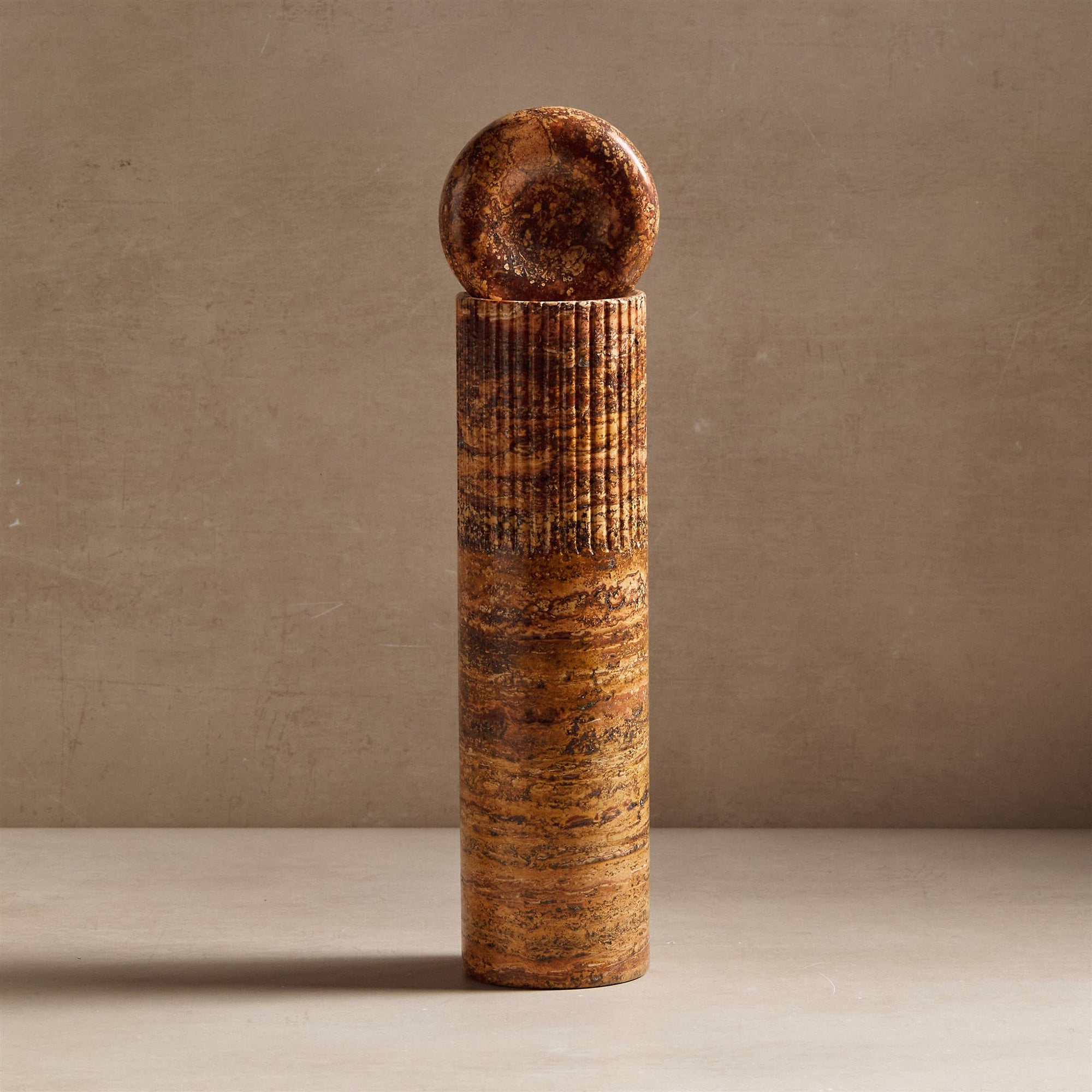 Atlas totem sculpture made from travertine stone for decor