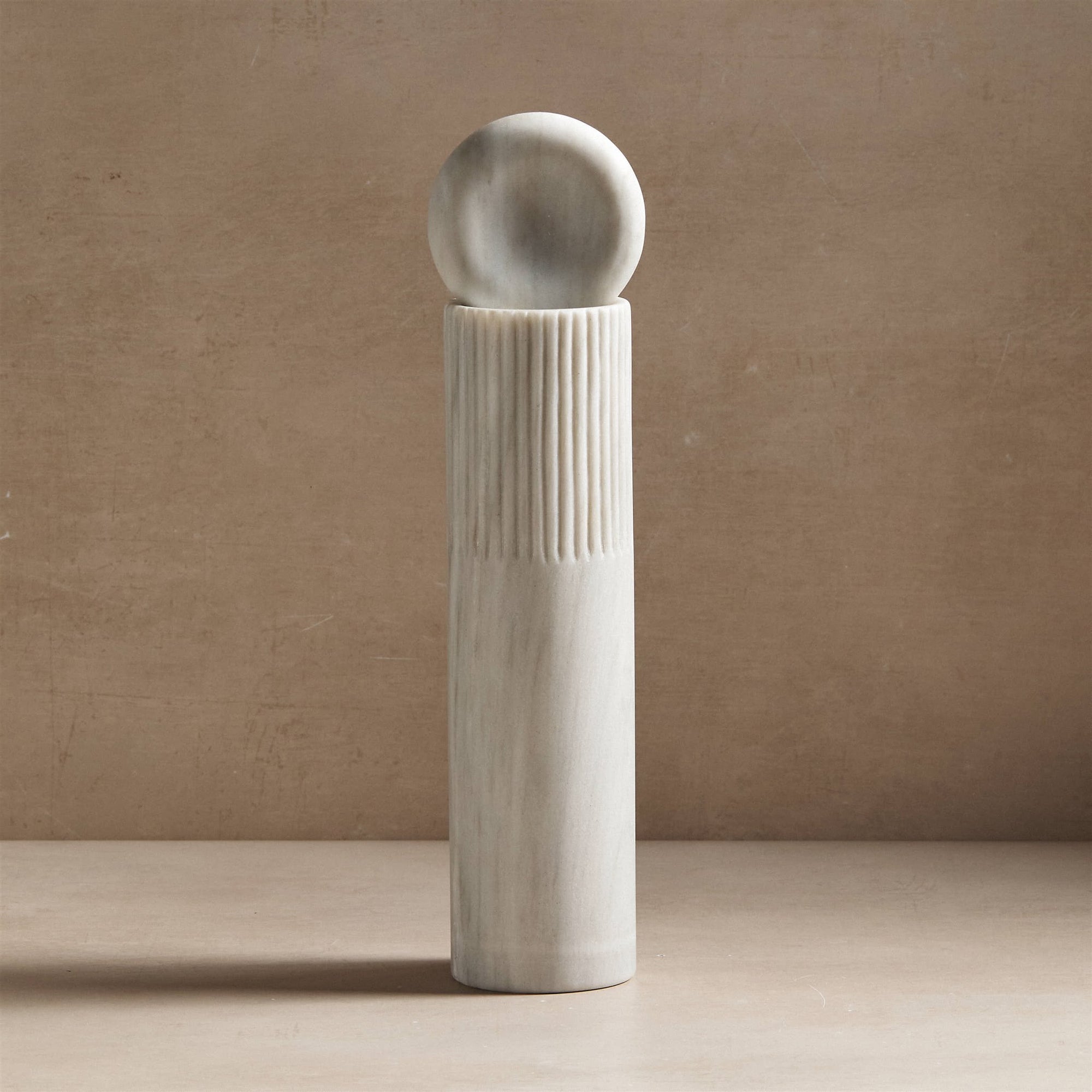 large totem sculpture made of white marble for decor