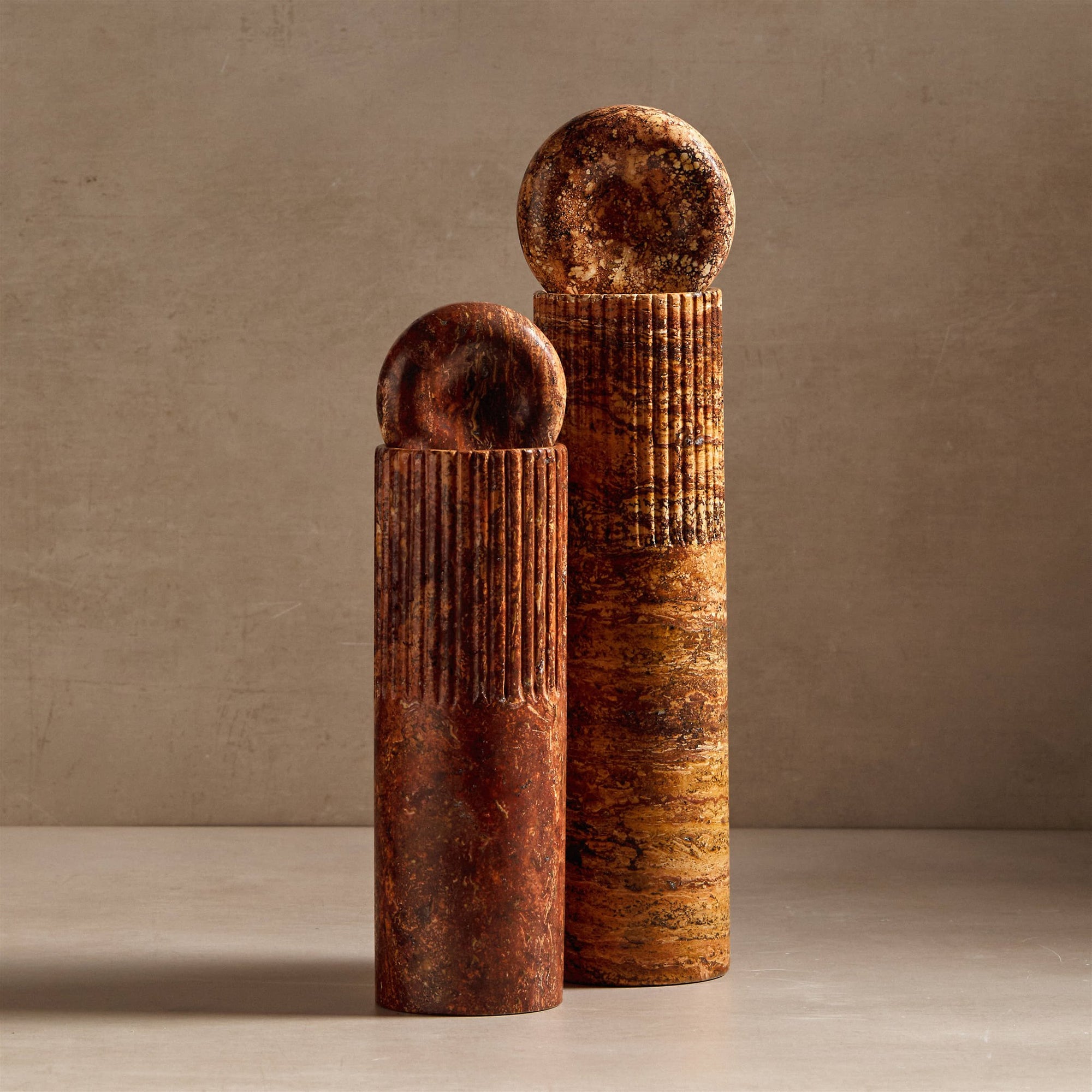 Atlas totem sculpture made from travertine stone for decor