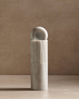 small totem sculpture made of white marble for decor