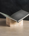 Bookstand holder made from ivory onyx stone displaying a book.