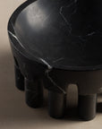 Pomona bowl made from black marble for holding fruit in a kitchen or decorative objects