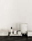 Collection of white marble decor and home accessories.