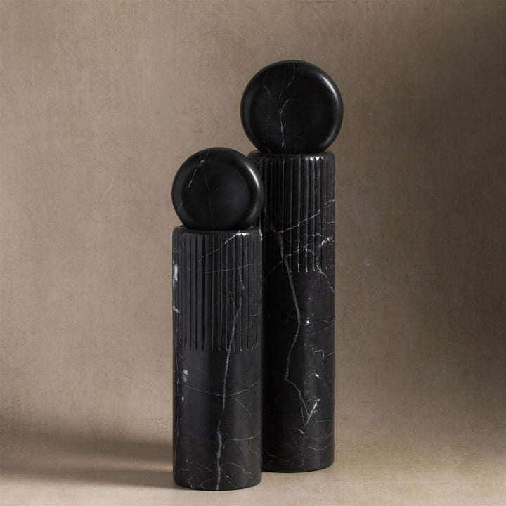 Matching black marble totems