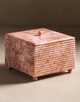 Pink marble square box with lid and ribbing details.