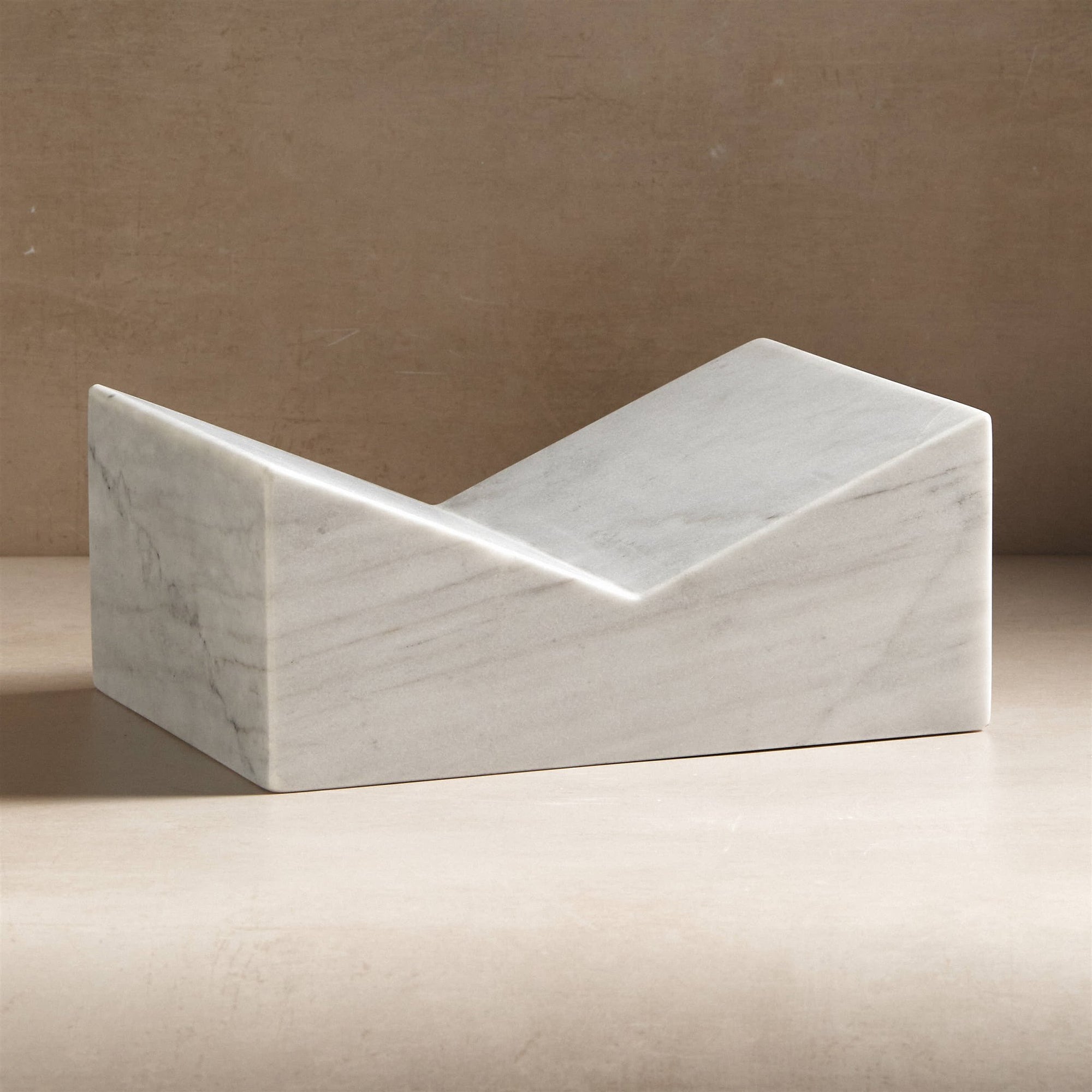 large stone bookstand made from white marble for holding books