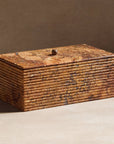 Stone box with ribbing made of travertine