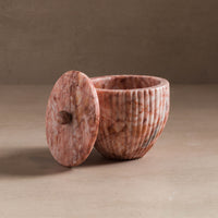 Small container with lid for bathroom or kitchen made from pink marble