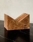 Bookstand holder made from travertine stone.