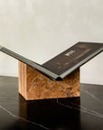 Bookstand holder made from travertine stone displaying a book.