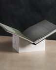 Bookstand holder made from white marble stone displaying a book