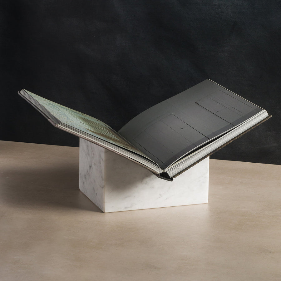Bookstand holder made from white marble stone displaying a book