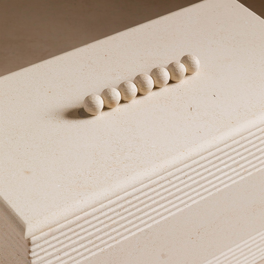 Studio H Collection Jonah Rectangular Stone Box with Ribbing and Ball Detail Lid - Cream Limestone